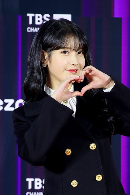 Singer IU poses for photos at the 36th Golden Disc Awards’ red carpet event held at Seoul’s Gocheok Sky Dome, Saturday. (Golden Disc Awards)