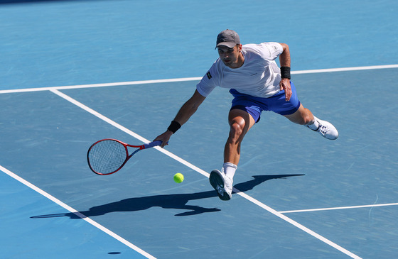 Marcos Giron of the United States competes during the men's singles first round match against Rafael Nadal of Spain at the Australian Open 2022 in Melbourne, Australia on Monday. [XINHUA/YONHAP]