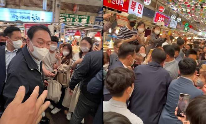 윤석열 대통령이 취임 후 첫 주말인 14일 서울 종로구 광장시장을 방문하고 있다. 대통령실은 윤 대통령이 부인 김건희 여사와 함께 광장시장을 찾아 빈대떡과 떡볶이 등을 포장 구매했다고 밝혔다.   연합뉴스