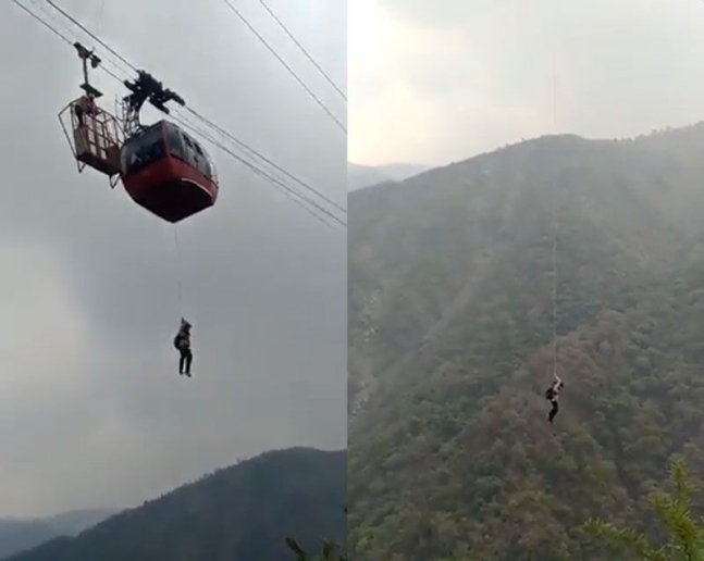 인도 북부 시발라크 산맥의 리조트에서 탑승객이 로프를 이용해 케이블카에서 탈출하고 있다. 트위터 캡처