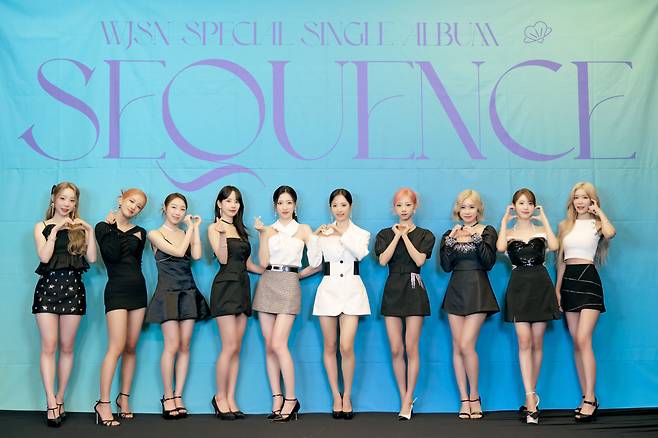 Cap/ Girl group WJSN poses for photos during a press conference for its fourth special single, “Sequence,” on Tuesday in Seoul. (Starship Entertainment)