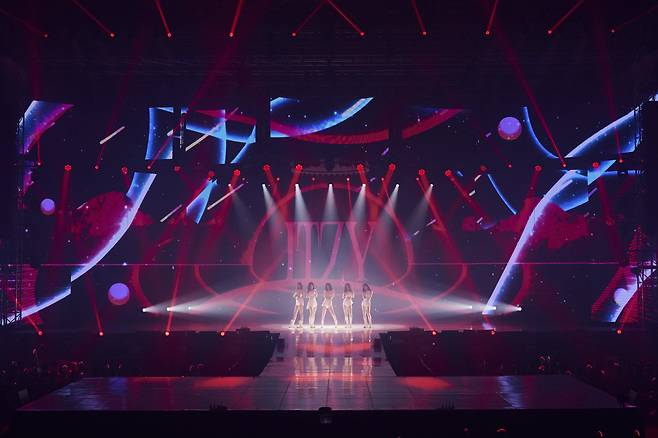 Girl group Itzy performs during its first world tour, “Checkmate,” in Seoul on Sunday. (JYP Entertainment)