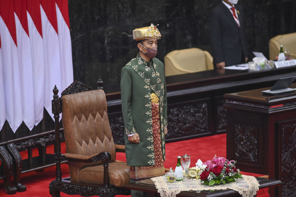 President Joko “Jokowi” Widodo, in traditional Bangka Belitung dress, stands prior to delivering his annual State of the Nation Address before the country’s executive, legislative and judicial branches at the House of Representatives complex in Jakarta on Aug. 16. (Antara/Galih Pradipta)