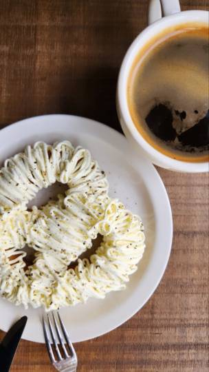 Butter pepper pretzel and black coffee at Bready Post located in Yongsan-gu, Seoul (Song Seung-hyun/The Korea Herald)