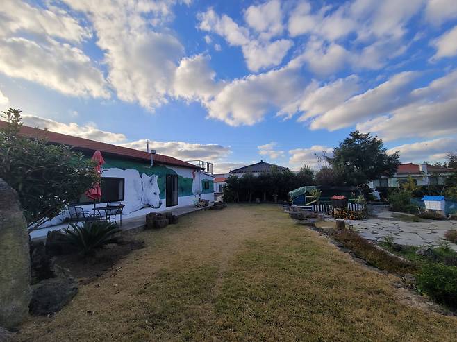 Next Door to the Museum Jeju welcomes visitors with Rirkrit Tiravanija's participatory project at the artist residency. (Park Yuna/The Korea Herald)