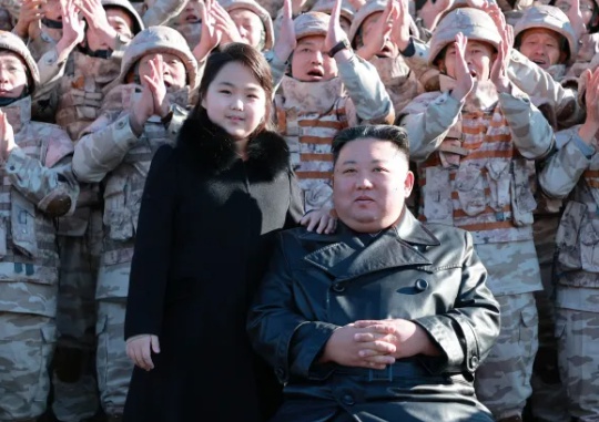 North Korean leader Kim Jong-un takes a picture along with his daughter (left of Chairman Kim) and the people who contributed to the development of the intercontinental ballistic missile Hwasong-17, which was launched on November 18. Yonhap News