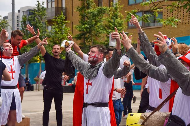 England football fans wearing knight costumes sing outside Wembley Stadium ahead of the England v Italy Euro 2020 final. (Getty Images)
