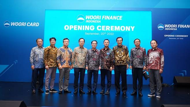 Woori Card chief executive officer Kim Jeong-ki (center) poses with company officials during the opening ceremony for its second global subsidiary on Nov.21 in Jakarta, Indonesia. (Woori Card)