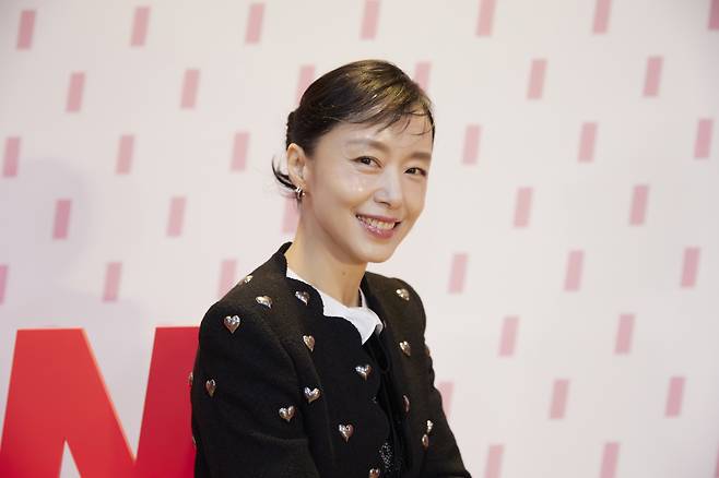 Jeon Do-yeon poses for photos before an online press conference Monday. (tvN)