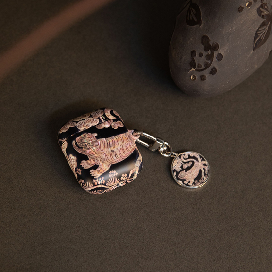 From top: Phone case and wireless earbuds cases made with najeon chilgi (lacquerware inlaid with mother-of-pearl) prints, by lifestyle brand Shelly [SHELLY]