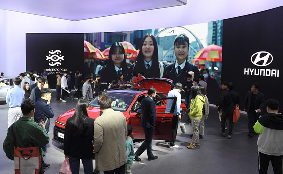 A promotional video to rally support for Busan's bid to host the 2030 World Expo surpassed 18 million views on YouTube, according to Hyundai Motor Group on Sunday. Hyundai Motor's booth is shown streaming the promotional video at the 2023 Seoul Mobility Show held at Kintex in Gyeonggi on the same day. [YONHAP]