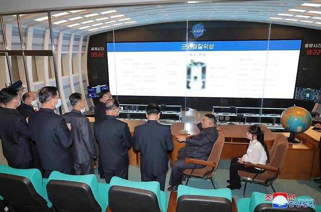 North Korean leader Kim Jong-un (sitting 2nd from Right), along with his daughter Ju-ae (Far Right), visits the National Aerospace Development Administration in Pyongyang on April 18, 2023, in this photo provided by the North's official Korean Central News Agency. (Yonhap)