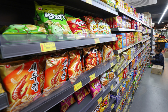 Snacks are displayed on the shelves at a supermarket in Seoul [YONHAP]