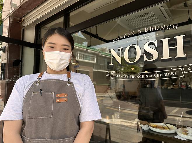 Lee Da-ye, Nosh’s owner and chef, stands in front of the all-day brunch restaurant, near Sindaebang Station in Gwanak-gu, southwestern Seoul, on April 28. (Ali Abbot/The Korea Herald)