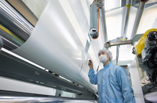 A worker of SK ie technology Co. inspects the separators. [Photo provided by SK innovation]