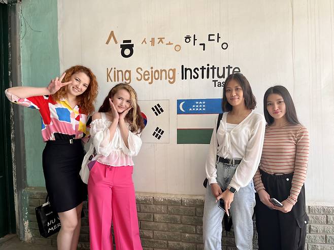 Four students of the King Sejong Institute in Tashkent pose for a photograph. From left: Madina and Kamila Takhirova, Elizaveta Kim and Gulsanam Nurbekova. (Kim Arin/The Korea Herald)