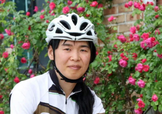 Na Hwa-rin, a transgender cyclist, poses for a picture in a café in Cheolwon-gun. Gangwon-do. Yonhap News