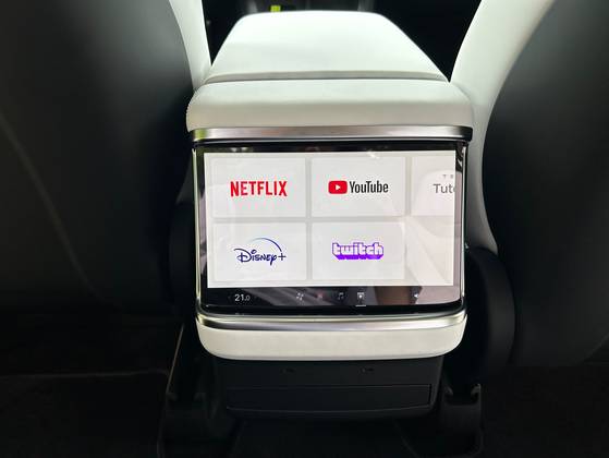 A smaller screen is also placed in the back seat, allowing passengers in the second and third rows to watch content. [SARAH CHEA]