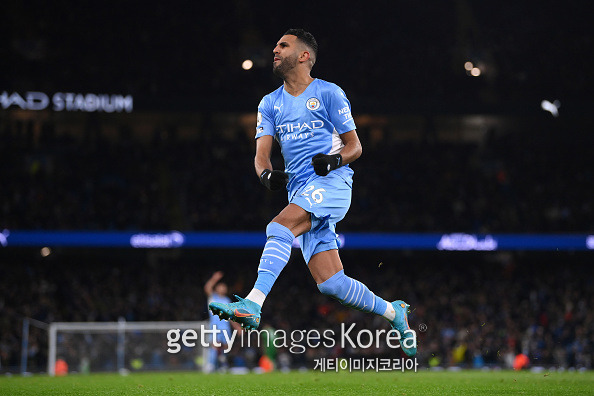 MANCHESTER, ENGLAND - FEBRUARY 19: Riyad Mahrez of Manchester City celebrates after scoring their side's second goal during the Premier League match between Manchester City and Tottenham Hotspur at Etihad Stadium on February 19, 2022 in Manchester, England. (Photo by Laurence Griffiths/Getty Images)