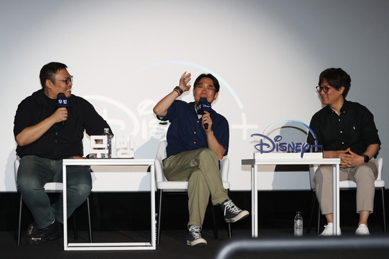 From left, webtoon artist Kang Full, director Park In-jee, visual effects supervisor Lee Sung-kyu speak during a press conference for ″Moving″ at CGV Yongsan in central Seoul on Thursday. [YONHAP]