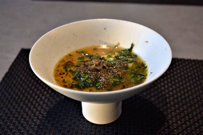 Javier Low's egg custard with black truffle and wild mugwort (Kim Hae-yeon/ The Korea Herald)
