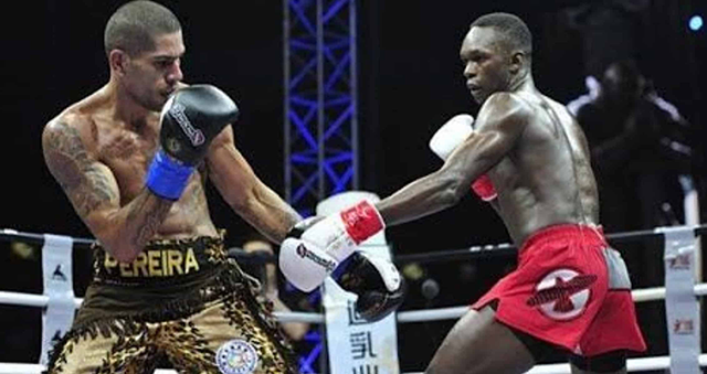 알렉스 페레이라(왼쪽)와 이스라엘 아데산야가 2016년 4월 중국 선전에서 열린 글로리 대회 도중 서로를 견제하고 있다. 당시 둘의 첫 대결은 페레이라가 아데산야한테 2-1 판정승을 거뒀다. 사진=GSUKCO LIMITED
