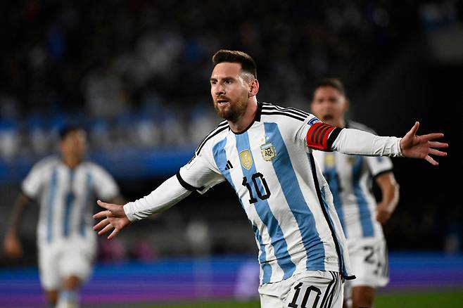 Argentina's forward Lionel Messi celebrates after scoring a goal during the 2026 FIFA World Cup South American qualifiers football match between Argentina and Ecuador, at the Mas Monumental stadium in Buenos Aires, on September 7, 2023. (Photo by Luis ROBAYO / AFP)