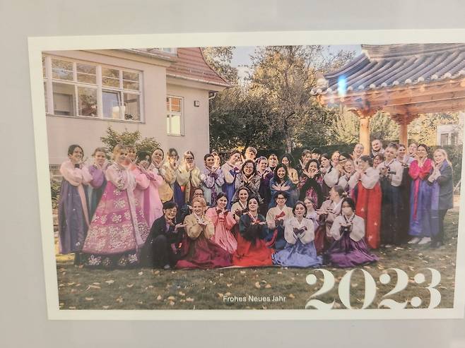 A group photo of Korean Studies students at Free University of Berlin wearing hanbok hangs on the wall of FUB's Institute of Korean Studies building. (Jung Min-kyung/The Korea Herald)