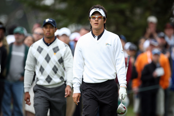 Ryo Ishikawa and the International Team walk from the 6th tee followed by Tiger Woods of the USA Team during the Day Three Afternoon Fourball Matches in The Presidents Cup at Harding Park Golf Course in San Francisco on Oct. 10, 2009.  [GETTY IMAGES]