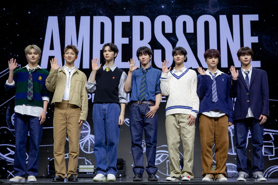 Ampers&One, FNC Entertainment's new seven-member boy band, poses for the camera during its debut showcase at the Blue Square in Yongsan District, central Seoul. [FNC ENTERTAINMENT]