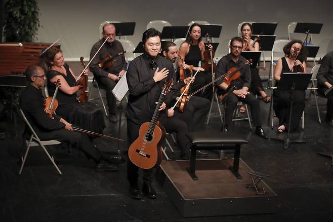 Deion Cho (center) at the guitar at the 56th Francisco Tarrega International Guitar Competition in Spain. (Courtesy of Deion Cho)