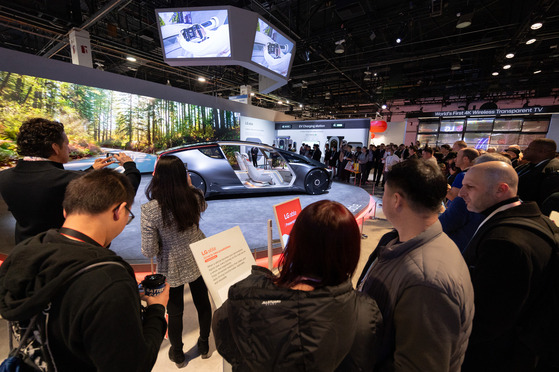 Visitors to CES 2024 take photos of LG Electronics’ Alpha-able concept car in Las Vegas. The trade show runs until Friday. [NEWS1]