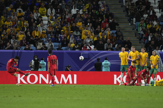Korea's Son Heung-min, left, scores his team's second goal against Australia  [AP/YONHAP]