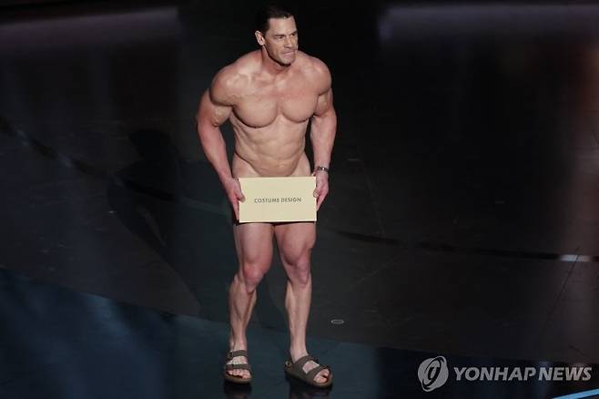 John Cena performs on stage during the presentation of the Oscar for Costume Design on stage during the Oscars show at the 96th Academy Awards in Hollywood, Los Angeles, California, U.S., March 10, 2024. REUTERS/Mike Blake