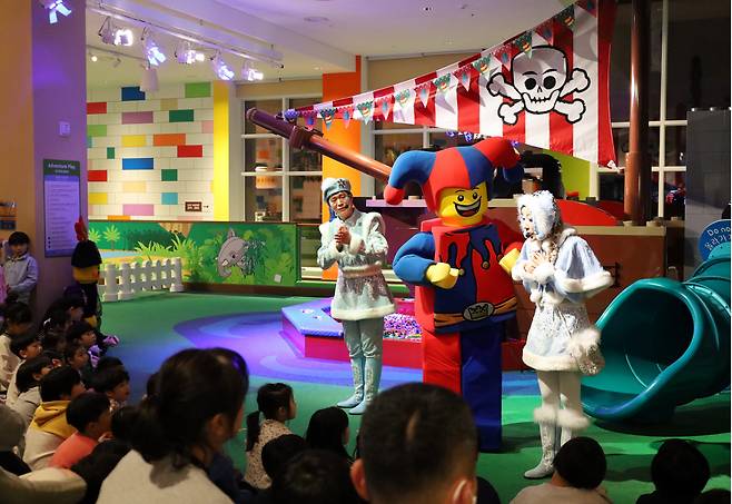 Children watch an indoor performance at Legoland Resort Korea. (Legoland Resort Korea)