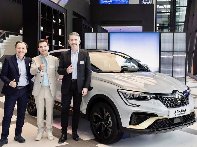 From left: Arnaud Belloni, Renault Group's vice president of global marketing, Stephane Deblaise, CEO of Renault Korea, and Gilles Vidal, the group's design director, stand next to the renamed Renault Arkana, formerly the XM3, during a press conference in Seoul on Wednesday. (Renault Korea)