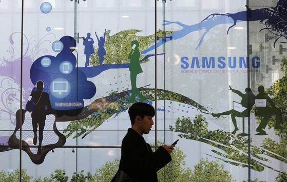 A man passes by Samsung Electronics' shop in Seoul on Wednesday, Jan. 31, 2024. [AP/YONHAP]