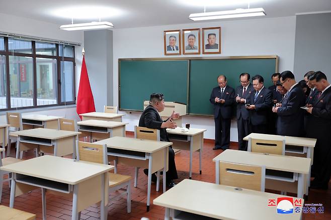 In this photo provided by the North Korean government, North Korean leader Kim Jong-un (left) inspects a class room of a newly built central cadres training school in Pyongyang, North Korea on Tuesday. (Yonhap)