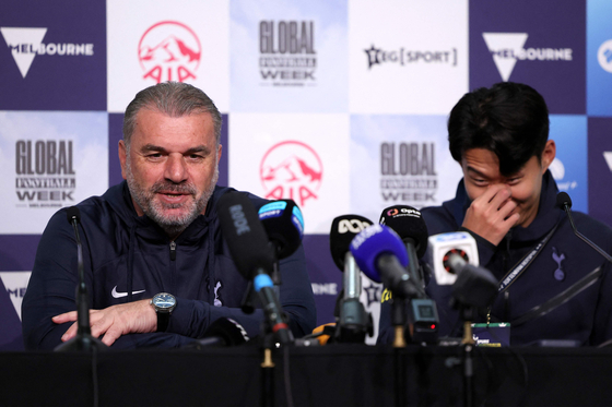 Tottenham Hotspur manager Ange Postecoglou, left, and captain Son Heung-min attend a press conference at AAMI Park in Melbourne on Tuesday ahead of their friendly match against Newcastle United. [AFP/YONHAP]