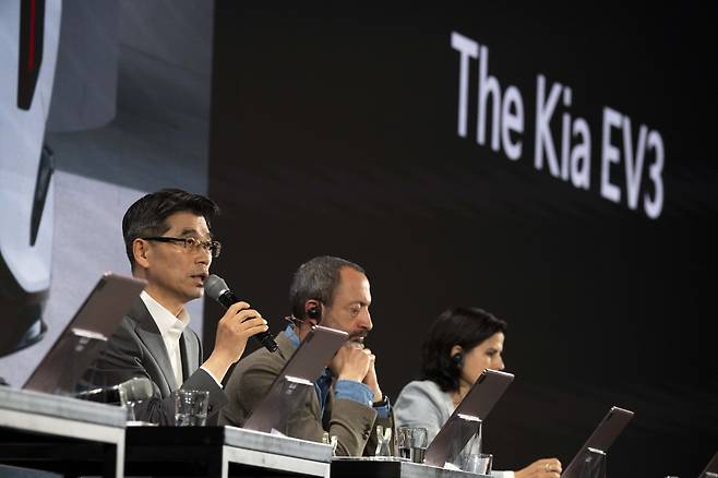 Kia CEO Song Ho-sung, Global Design Head Karim Habib, and Color, Material & Finish Design Head Marilia Biill speak at the EV3 introduction media conference. (Kia)