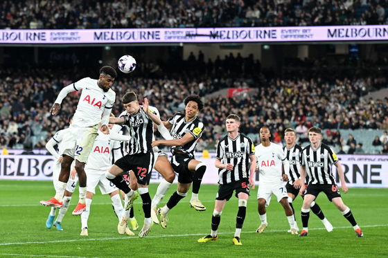 Tottenham Hotspur defender Emerson Royal, far left, headers the ball during a postseason match against Newcastle United at Melbourne Cricket Ground in Melbourne, Australia on Wednesday. [EPA/YONHAP]