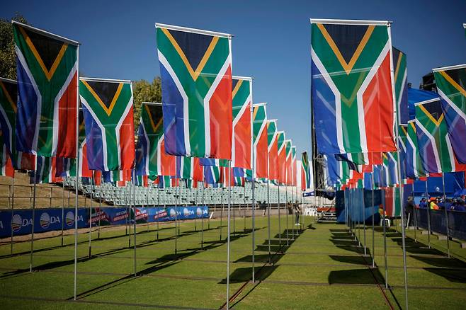 A general view of South African flags is displayed at the main opposition Democratic Alliance final rally in Benoni on Sunday, ahead of the South African elections scheduled for Wednesday. (AFP)