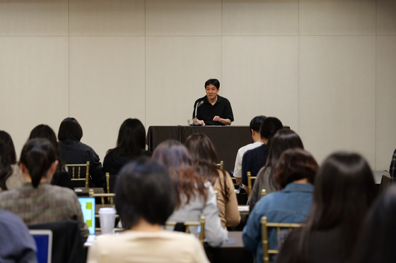 Lee Sung-goo, CEO of virtual boy band Plave's agency and production company Vlast, answers questions from reporters during a press conference held Monday in western Seoul. [VLAST]