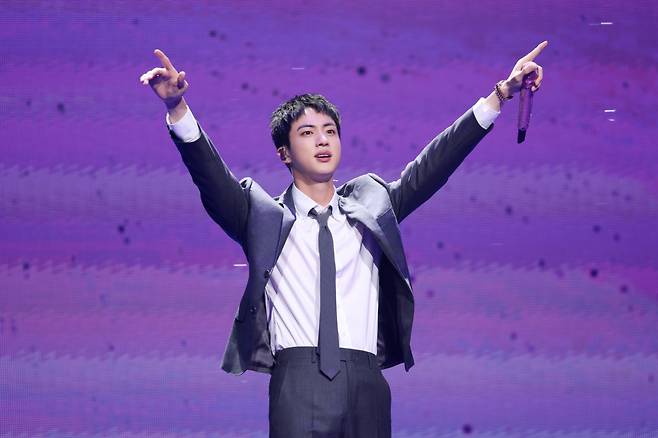 Jin of BTS greets fans during a fan meeting event at Jamsil Arena in Seoul on Thursday. (Big Hit Music)