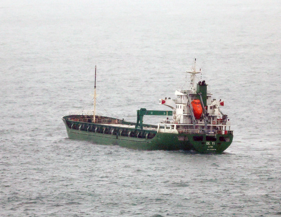 The stateless 3,000-ton ship De Yi is forced to dock in waters off Gamcheon Port in Busan on April 3, 2023. South Korean authorities reportedly seized the ship recently in territorial waters, suspecting it of violating U.N. sanctions on North Korea. [YONHAP]