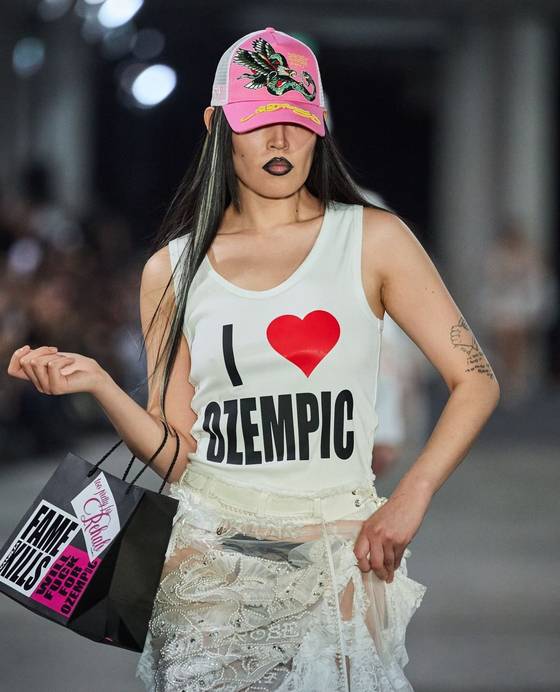 Clubwear brand Namilia featured a graphic top that reads″ I (heart) Ozempic″ during its fashion show in Berlin on July 6. [GETTY IMAGES]