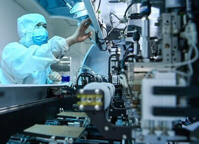 Workers on a LCD display module automated production line in the Peng'an Industrial Park, Nanchong city, Sichuan province.