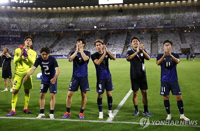 승리를 자축하는 일본 올림픽 축구대표팀 선수들 [로이터=연합뉴스]