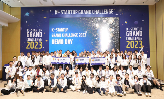 Participants for the 2023 K-Startup Grand Challenge demo day event pose for a photo in November last year. [NEWS1]