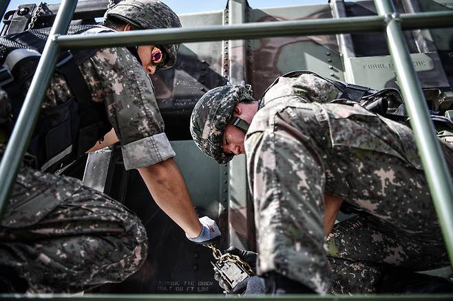 South Korean airmen are seen stacking guided missiles needed for a surface-to-air missile system at an Air Force base in Daegu on Thursday. (Courtesy of South Korean Air Forces)